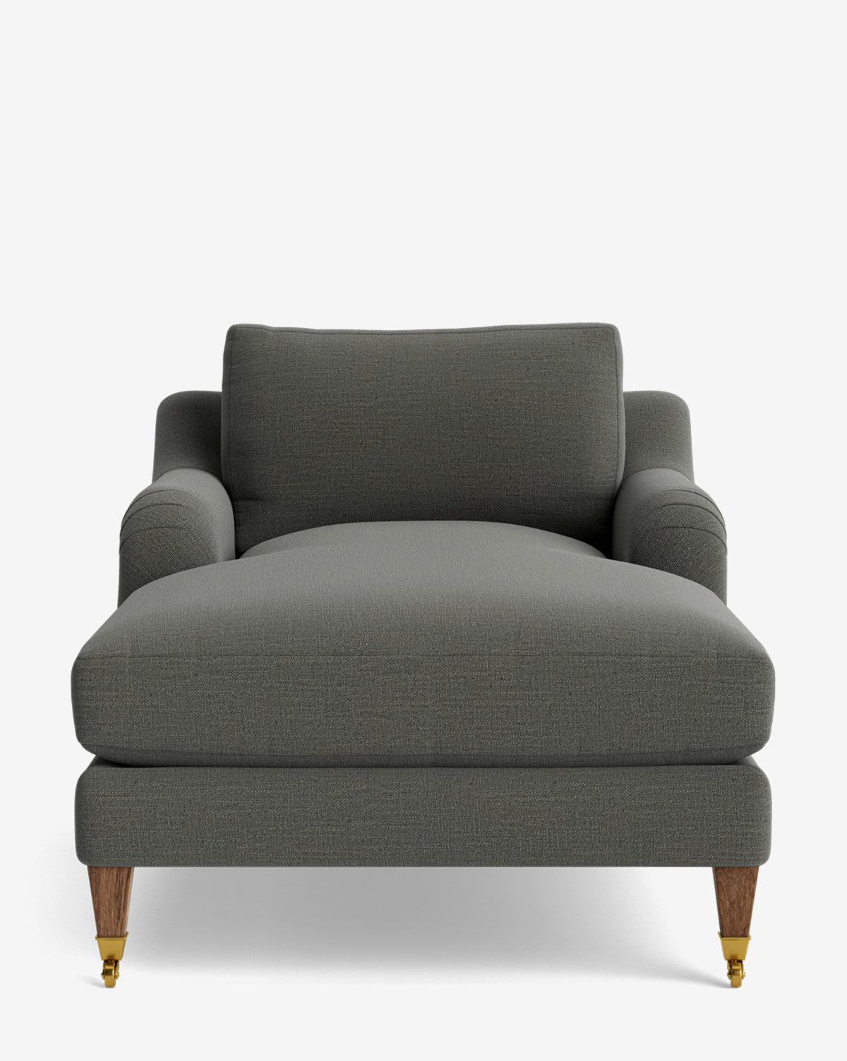 A front view of the Lucille English Roll Arm Chaise Lounge in dark gray, featuring two wooden back legs, two brass-castered front legs, wide rounded armrests, and a down-wrapped cushion, by McGee & Co.