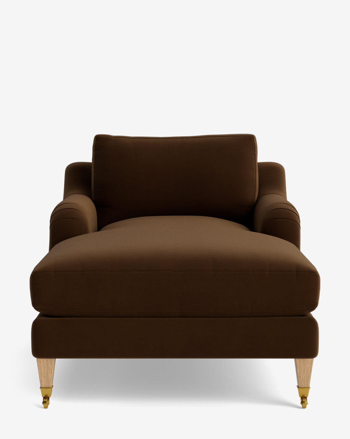 The Lucille English Roll Arm Lounge Chair is shown front-facing with brown upholstery, a cushioned backrest, down-wrapped seat, curved armrests, and light wooden legs—two with small brass casters, by McGee & Co.