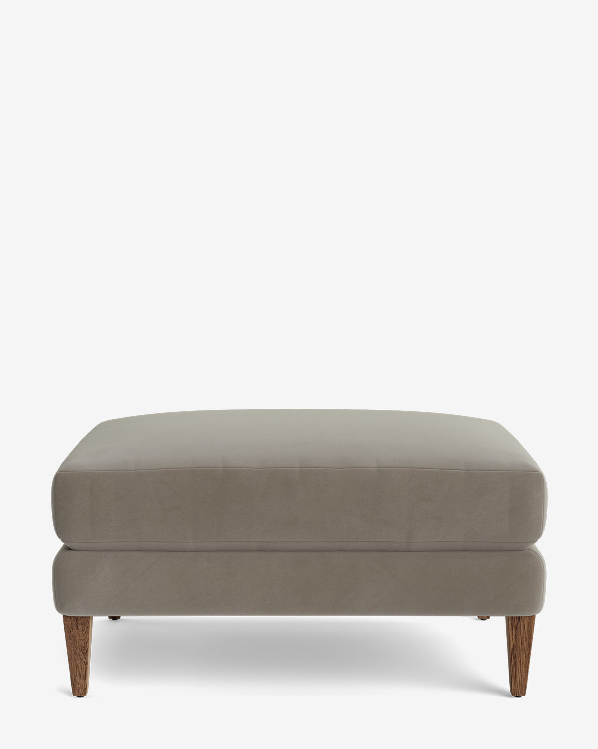 The Lucille Ottoman is a modern square ottoman with light gray upholstery and wooden legs, displayed against a white background, by Vendixs