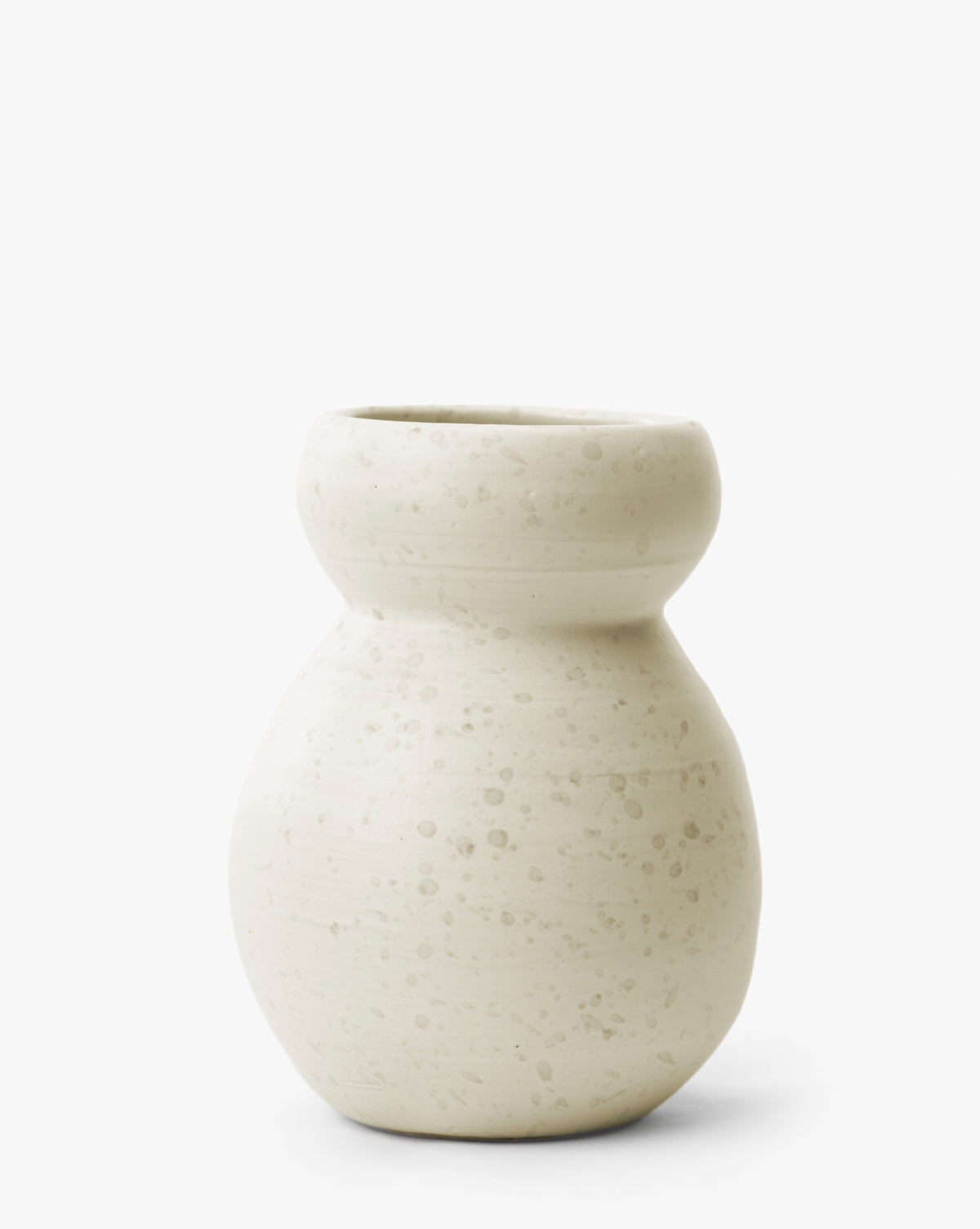 The Lyra Vase is a modern white ceramic vase with a round base, narrow neck, and wide rim, featuring a speckled off-white matte finish on a plain white background, by Vendixs