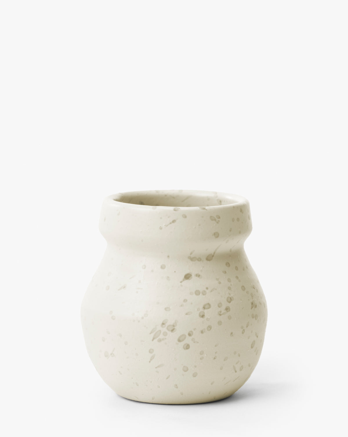 The Lyra Vase is a small, modern white ceramic vase with a wide neck and narrow base, featuring light beige tones and subtle speckled patterns, by Vendixs