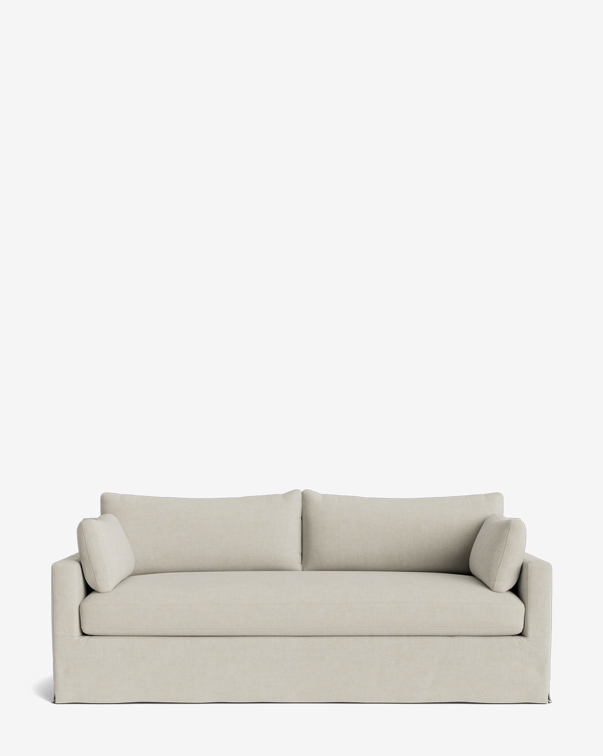 The Peterson Classic Slipcover Sofa (75-100) by Rowe Fine Furniture features a modern beige boxy design, two back cushions, feather blend seating, and two cylindrical side pillows, displayed against a white background. Vendixs