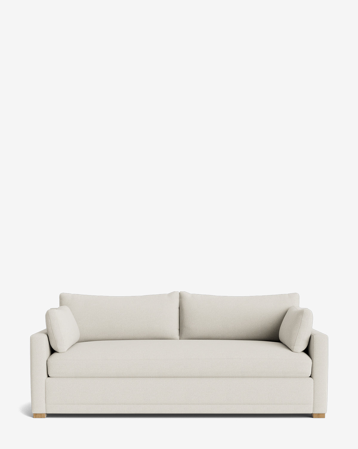 The Peterson Classic Upholstered Sofa (75–100) by Rowe Fine Furniture features a modern light beige design with plush cushions, two matching back cushions, two bolster pillows, straight arms, and wooden legs against a white background. Vendixs