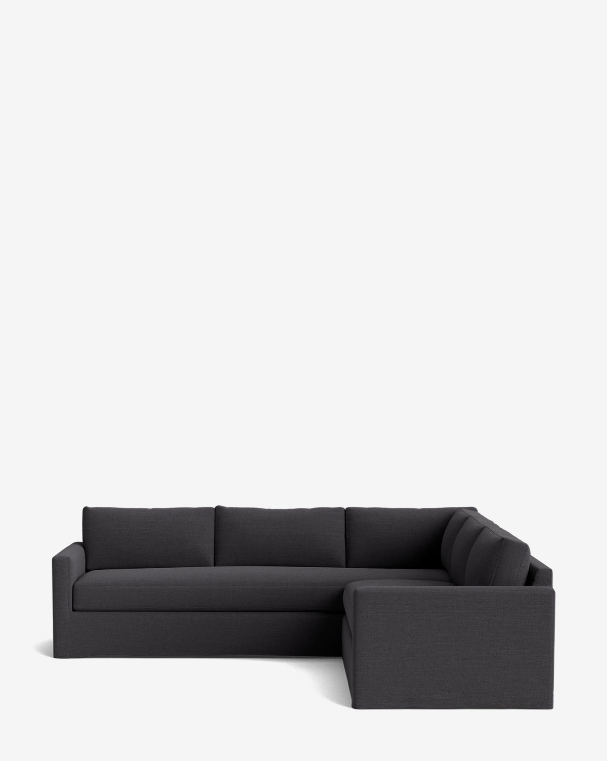 A modern Macy Slipcover L Sectional 108 in dark gray, with clean lines and low backrests, features a deep silhouette against a plain white background, by McGee & Co.