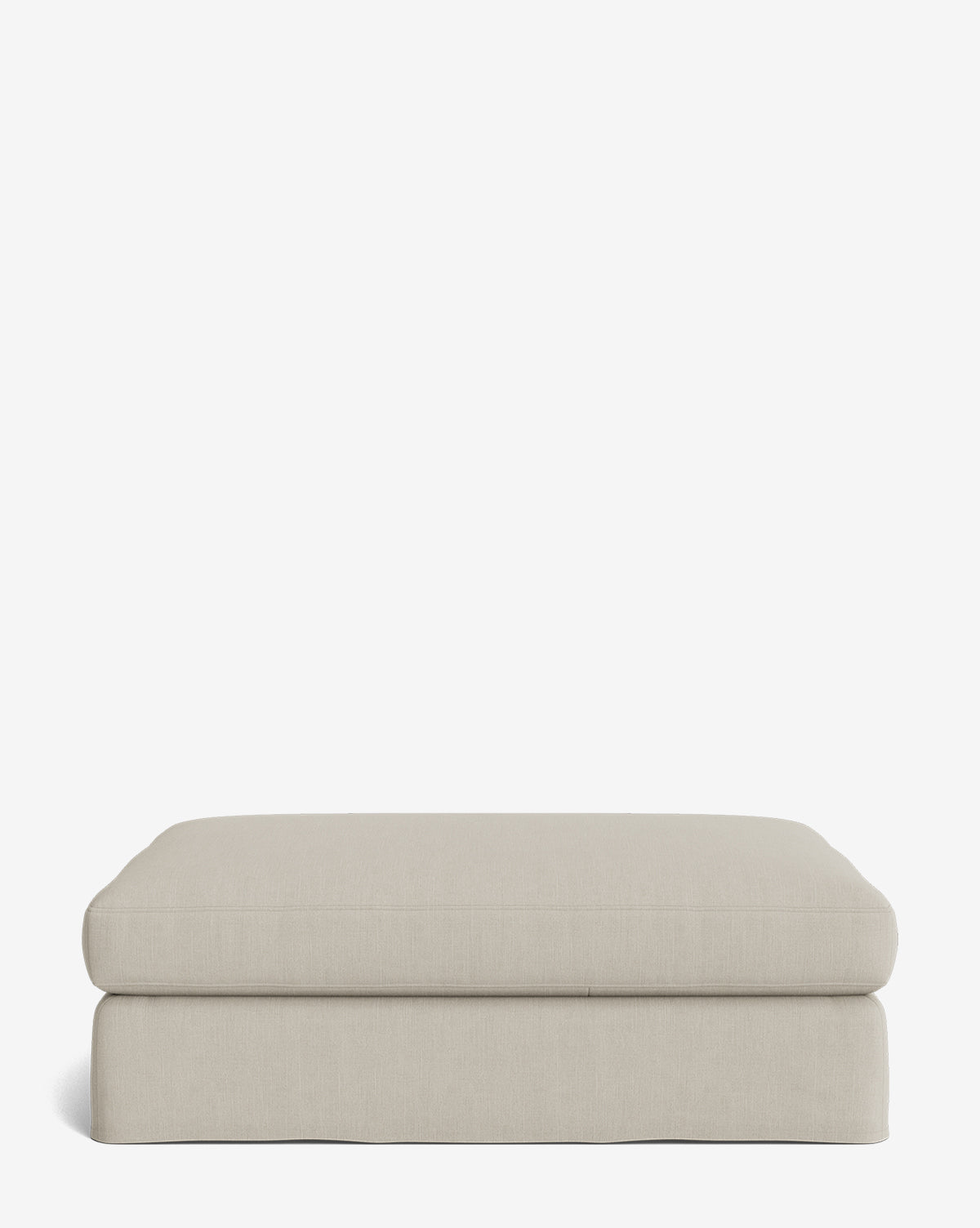 The Macy Slipcover Ottoman is a rectangular, light beige upholstered piece with a simple modern design, perfect as customizable living room furniture, by McGee & Co. It sits on a white background.