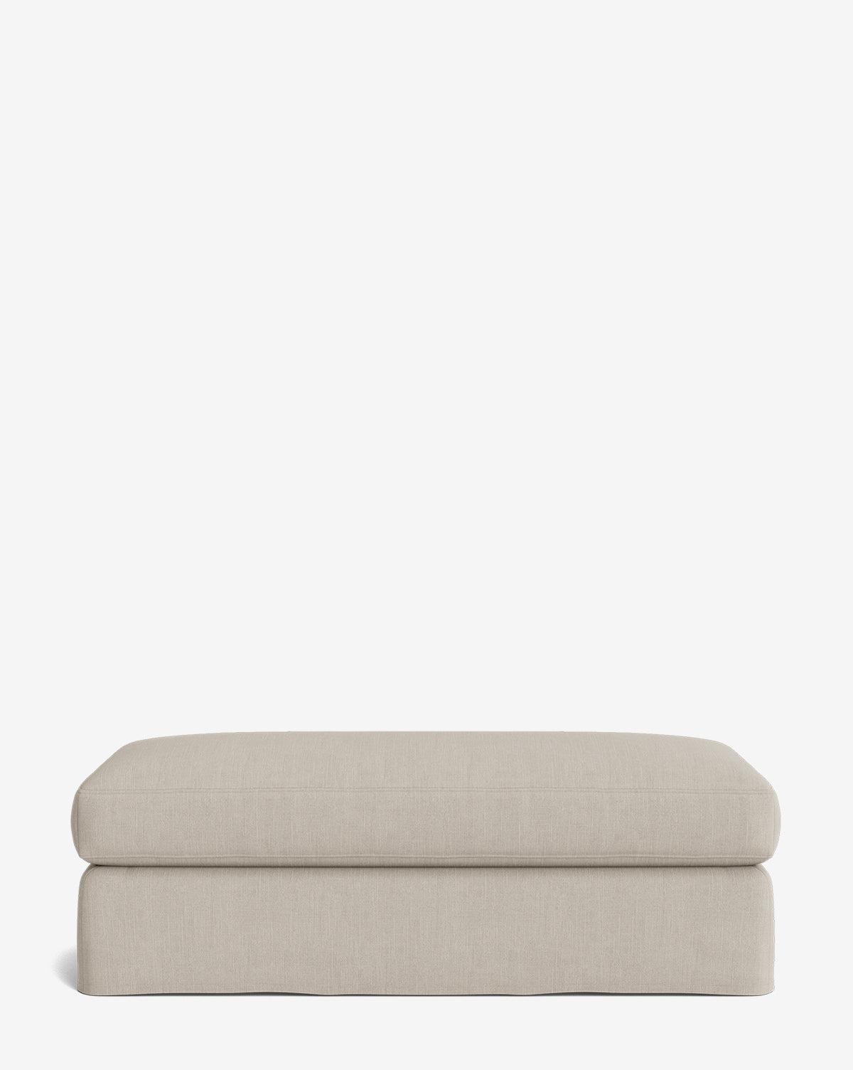 The Macy Slipcover Ottoman, in a rectangular light beige design with soft, rounded edges, sits on a plain white background—a stylish and comfortable addition to any living room, by Vendixs