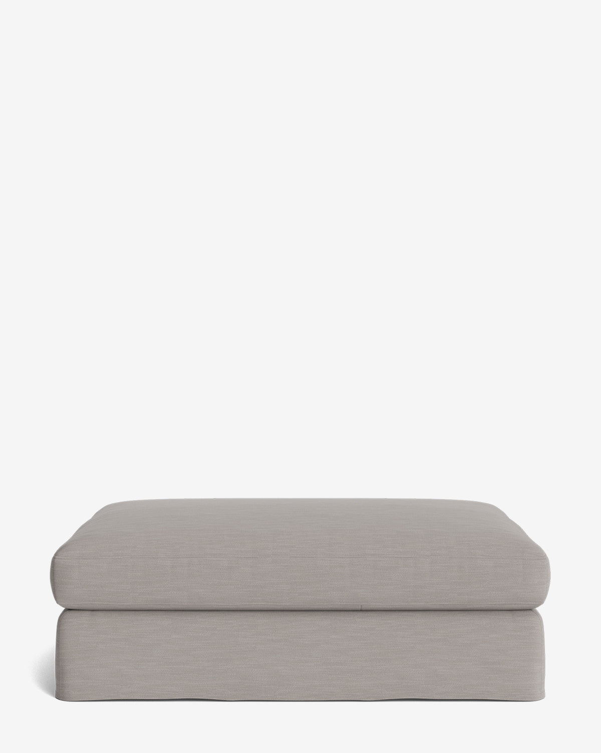 The Macy Slipcover Ottoman features a modern, rectangular design in light gray with soft, rounded edges and a minimalist look—ideal as customizable living room furniture—shown on a plain white background, by Vendixs