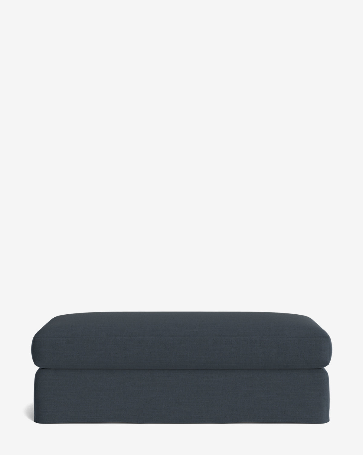 The Macy Slipcover Ottoman is a modern rectangular dark blue ottoman with a minimalist design and cushioned top—perfect for your living room, shown here on a plain white background, by Vendixs