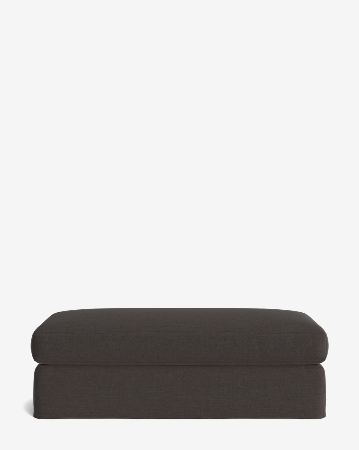 The Macy Slipcover Ottoman features a rectangular, dark gray design with modern simplicity, making it a versatile addition to any living room, by Vendixs Pictured against a plain white background.