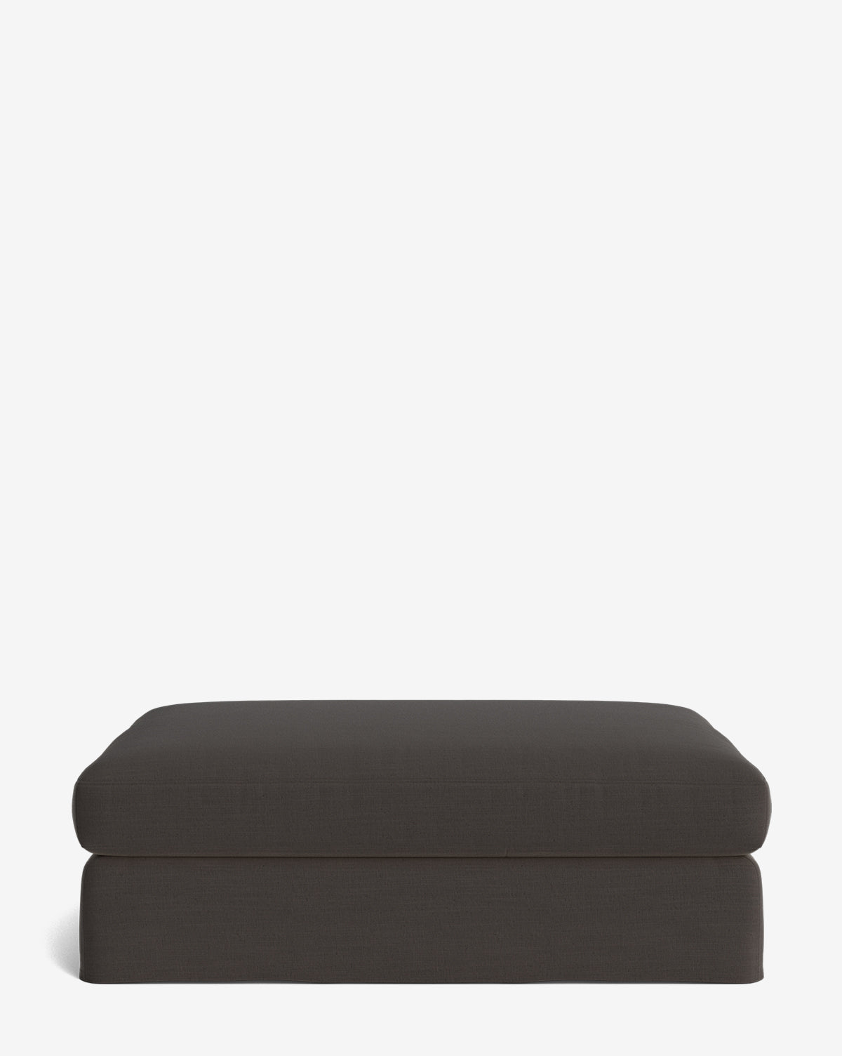 The Macy Slipcover Ottoman, featuring a rectangular shape and dark gray color, offers a simple modern design ideal for versatile living room use, by Vendixs Shown against a plain white background.