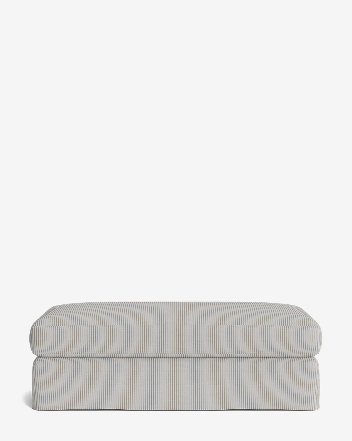 The Macy Slipcover Ottoman is a rectangular, cushioned piece featuring light gray and white vertical pinstripes—perfect as customizable living room furniture—shown against a plain white background, by McGee & Co.