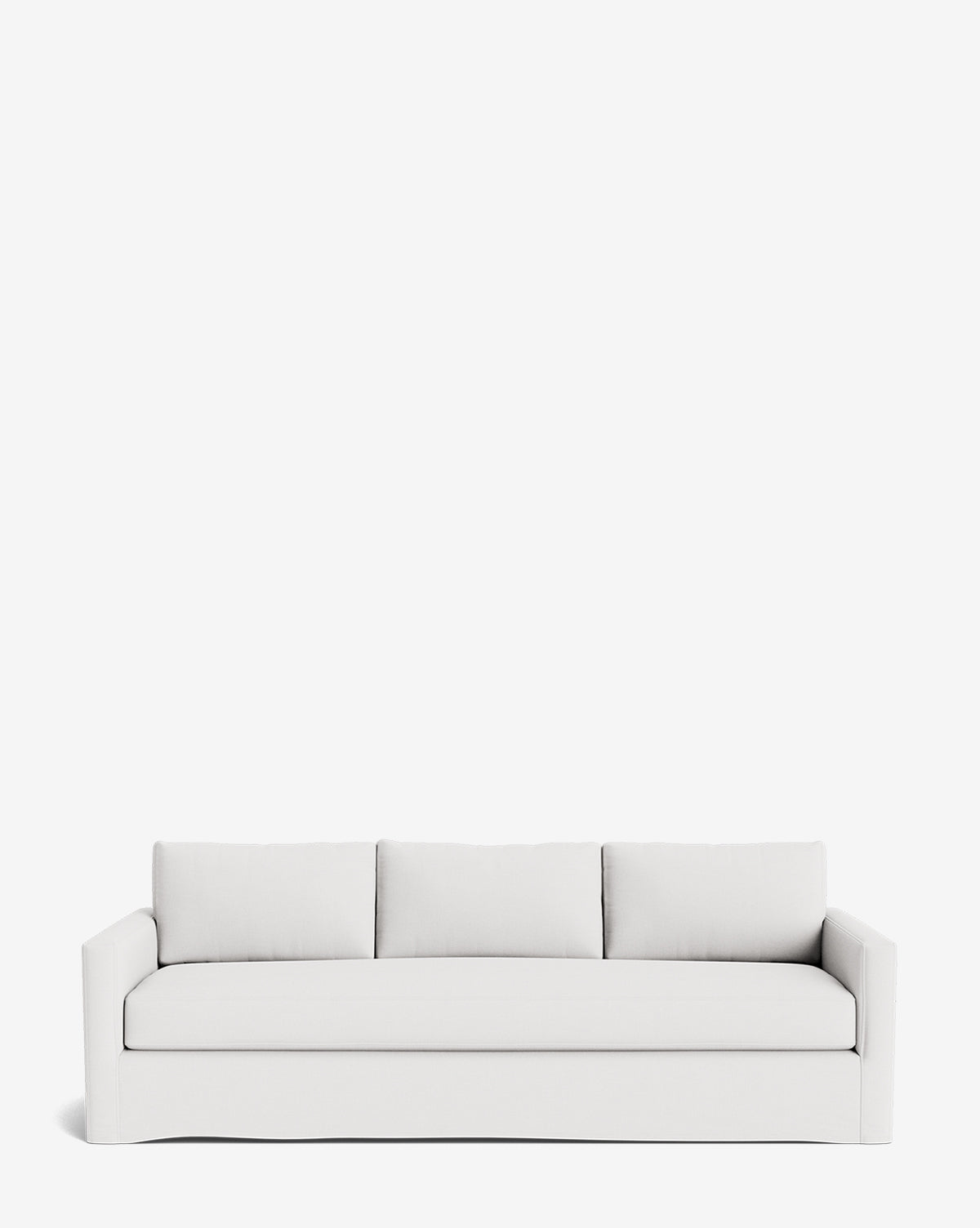 The Macy Slipcover Sofa (84-96) is a modern, minimalist white sofa with three seat and back cushions, straight arms, and a skirted base, shown against a plain white background by Vendixs