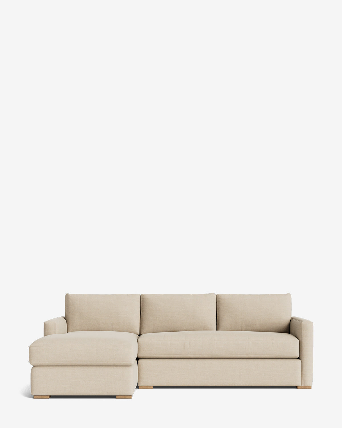 The Community Macy Upholstered Chaise Sectional 101 is a modern, minimalist sofa with a left-facing chaise, three seat cushions, three back cushions, and low wooden legs, shown set against a plain white background. Vendixs