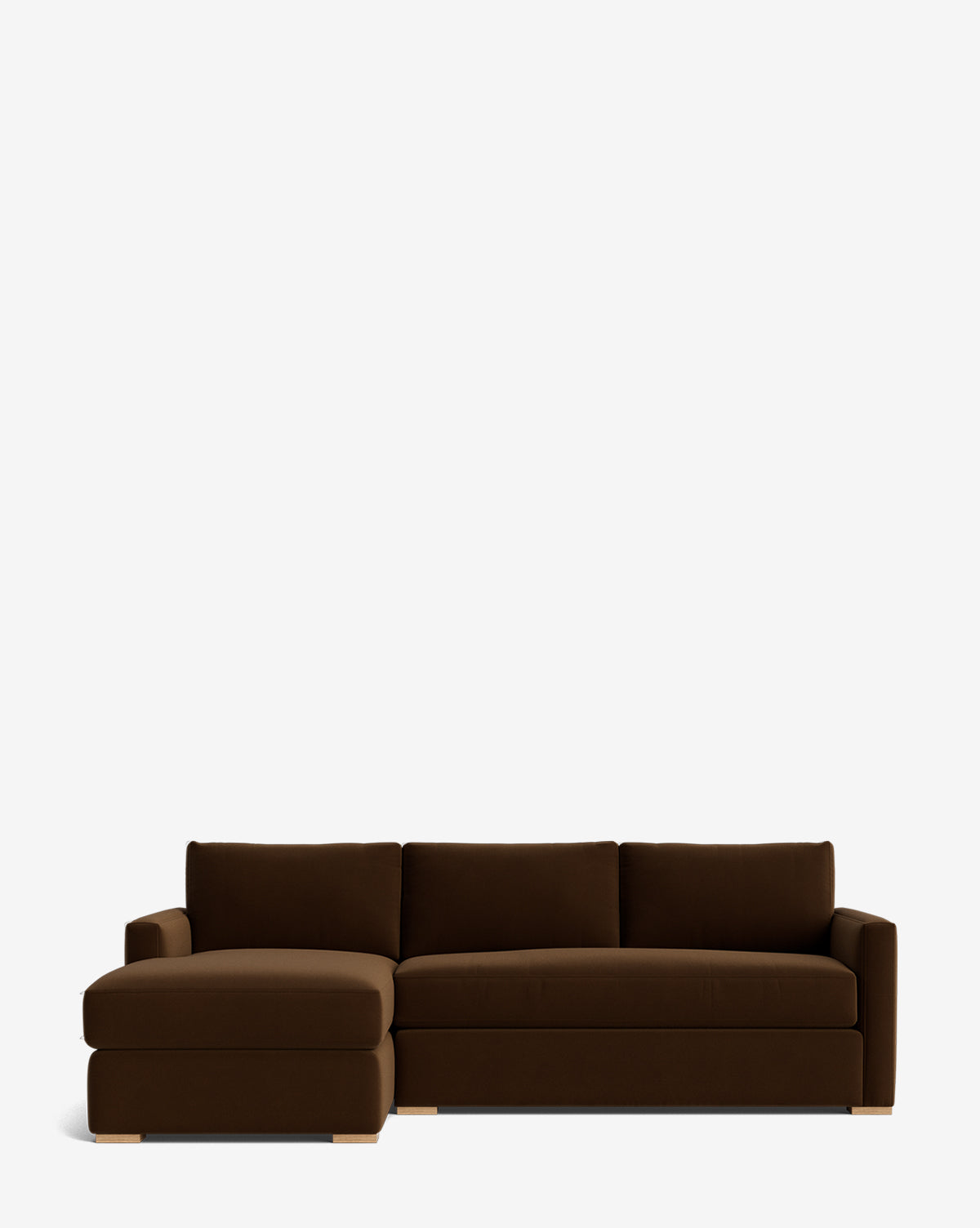 The Community Macy Upholstered Chaise Sectional 101 features three back cushions and a left-side chaise lounge, all set on light wooden legs and photographed against a plain white background. Vendixs