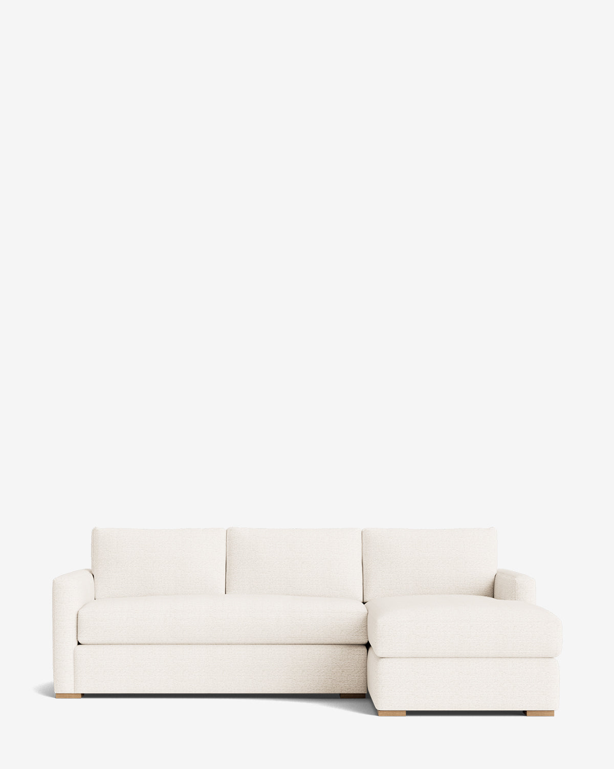 The Macy Upholstered Chaise Sectional 101 is a modern, off-white customizable sofa featuring three seat cushions and a right-facing upholstered chaise, shown against a plain white background by McGee & Co.