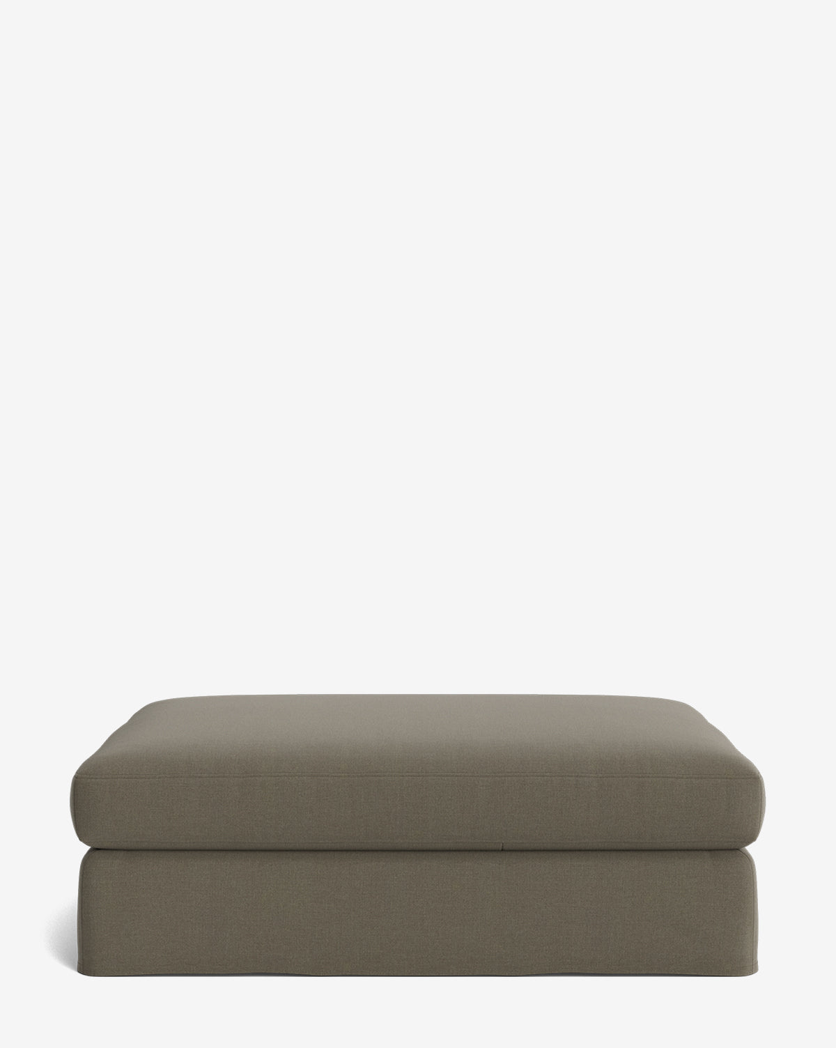 The Macy Slipcover Ottoman is a rectangular, gray ottoman with a flat top and rounded edges, ideal for customizable living room décor, shown against a plain white background, by McGee & Co.