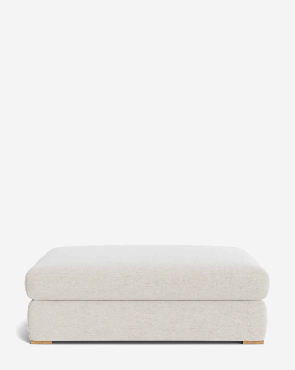 The Macy Upholstered Ottoman features a rectangular, light beige design with low wooden feet and simple modern style, making it a customizable and stylish addition to your living room, by McGee & Co. Pictured against a plain white background.