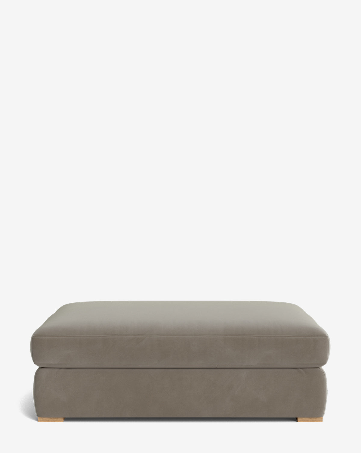 The Macy Upholstered Ottoman is a rectangular, taupe piece with a smooth top and minimal wooden feet, perfect for versatile living room use, shown on a white background by Vendixs