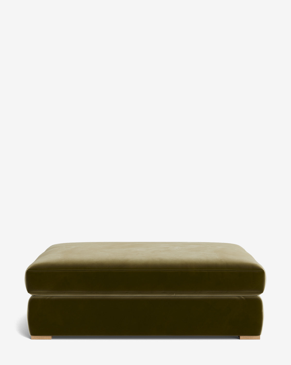 The Macy Upholstered Ottoman features a square, olive green design with a plush cushioned top, velvety smooth texture, minimal style, and short block feet, shown against a plain white background. Ideal as living room furniture, by McGee & Co.