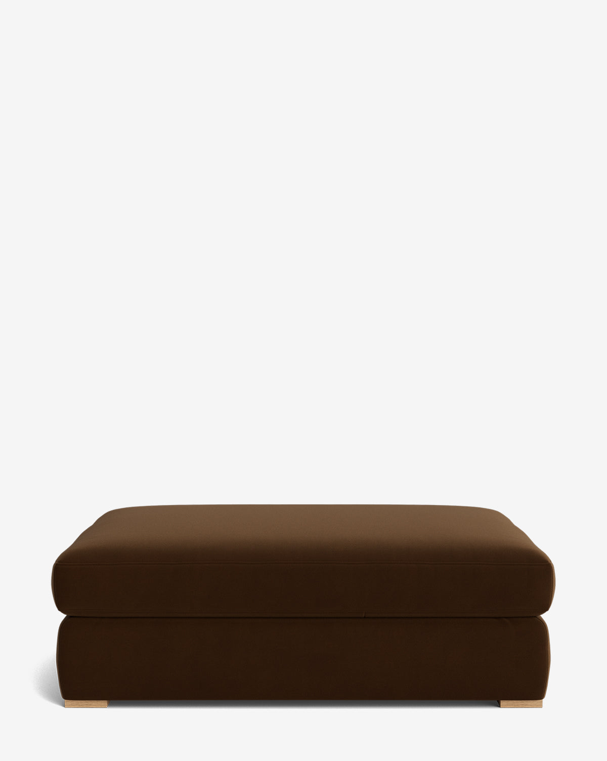 The Macy Upholstered Ottoman features a rectangular, dark brown design with simple modern style and short light legs, making it a stylish addition to your living room furniture, shown against a plain white background by Vendixs