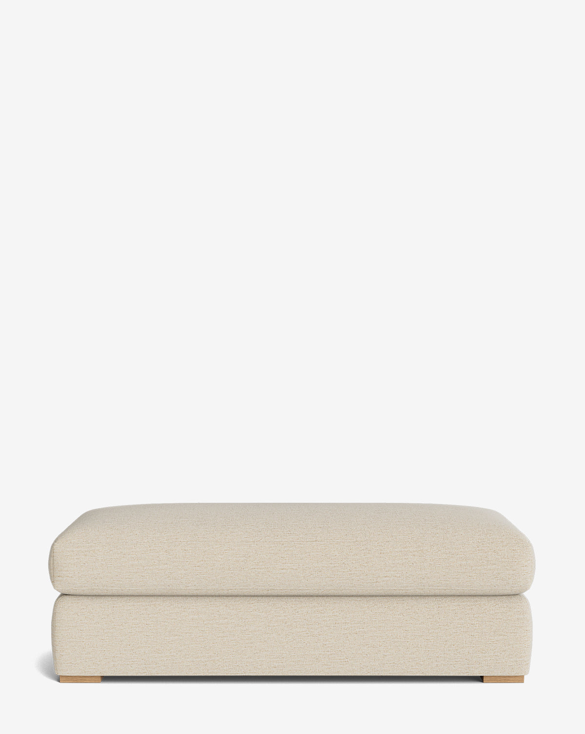 The Macy Upholstered Ottoman features a rectangular, beige design with modern simplicity and low wooden feet, making it a stylish addition to your living room decor, by McGee & Co. Shown against a plain white background.