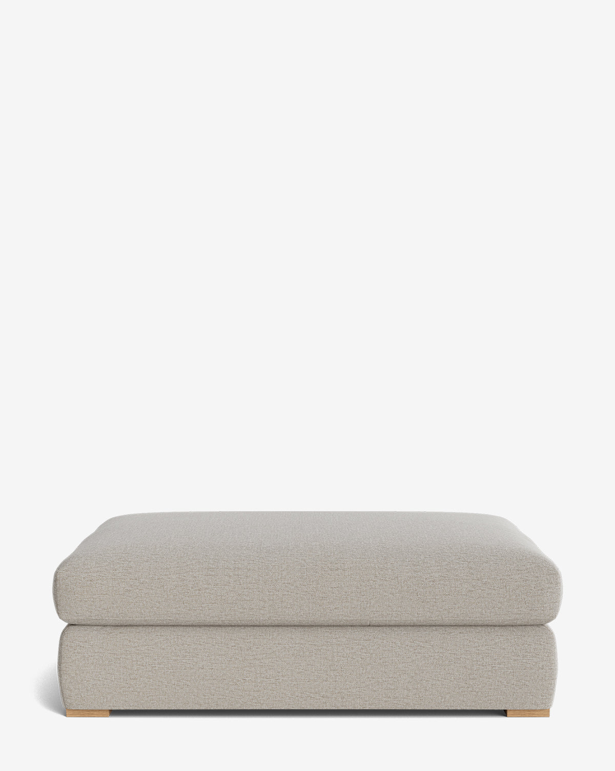 The Macy Upholstered Ottoman features a modern rectangular design in light gray with a soft cushioned top and low wooden feet—an ideal choice for your living room, shown against a plain white background by Vendixs