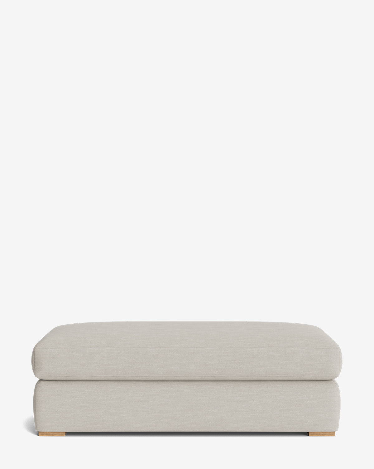The Macy Upholstered Ottoman is a modern, rectangular piece in light gray with clean lines and low wooden feet—perfect as stylish living room furniture, shown against a plain white background by McGee & Co.