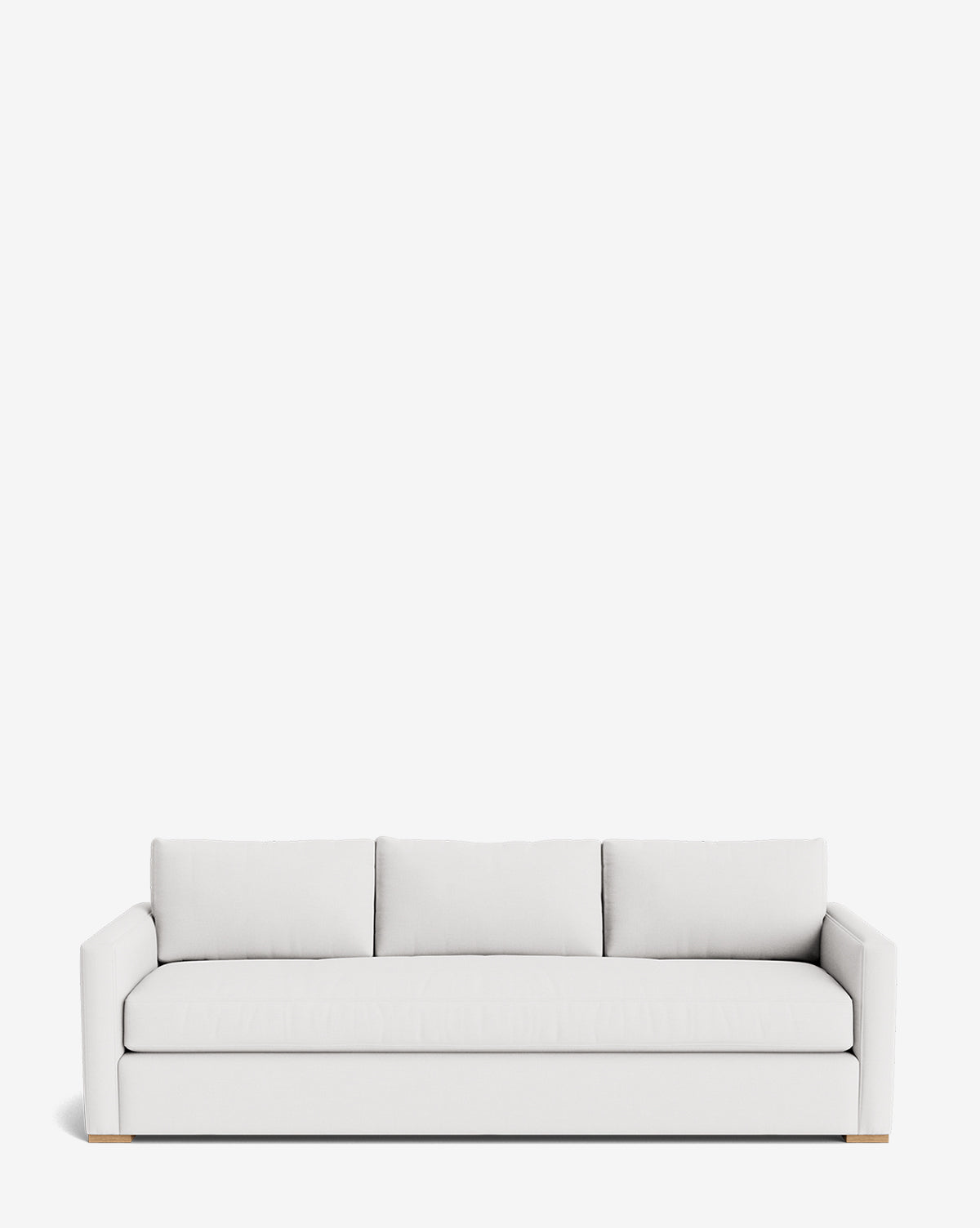 The Macy Upholstered Sofa (84-96) is a modern, minimalist piece with three back cushions, straight arms, clean lines, a low profile, and subtly visible wooden feet, shown against a plain white background by Vendixs