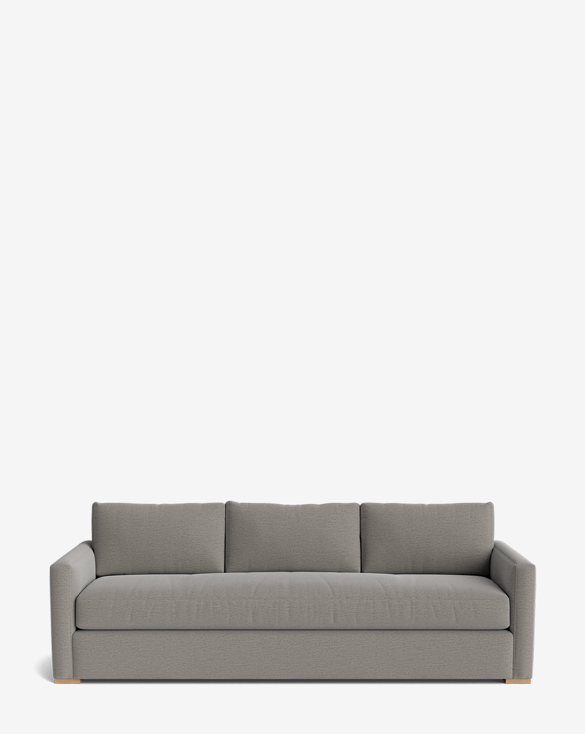 The Macy Upholstered Sofa (84-96) features a modern, light gray upholstery with three back cushions, wide armrests, and low wooden feet. Its minimalist design makes it a stylish choice for any living room, by Vendixs Set against a plain white background.