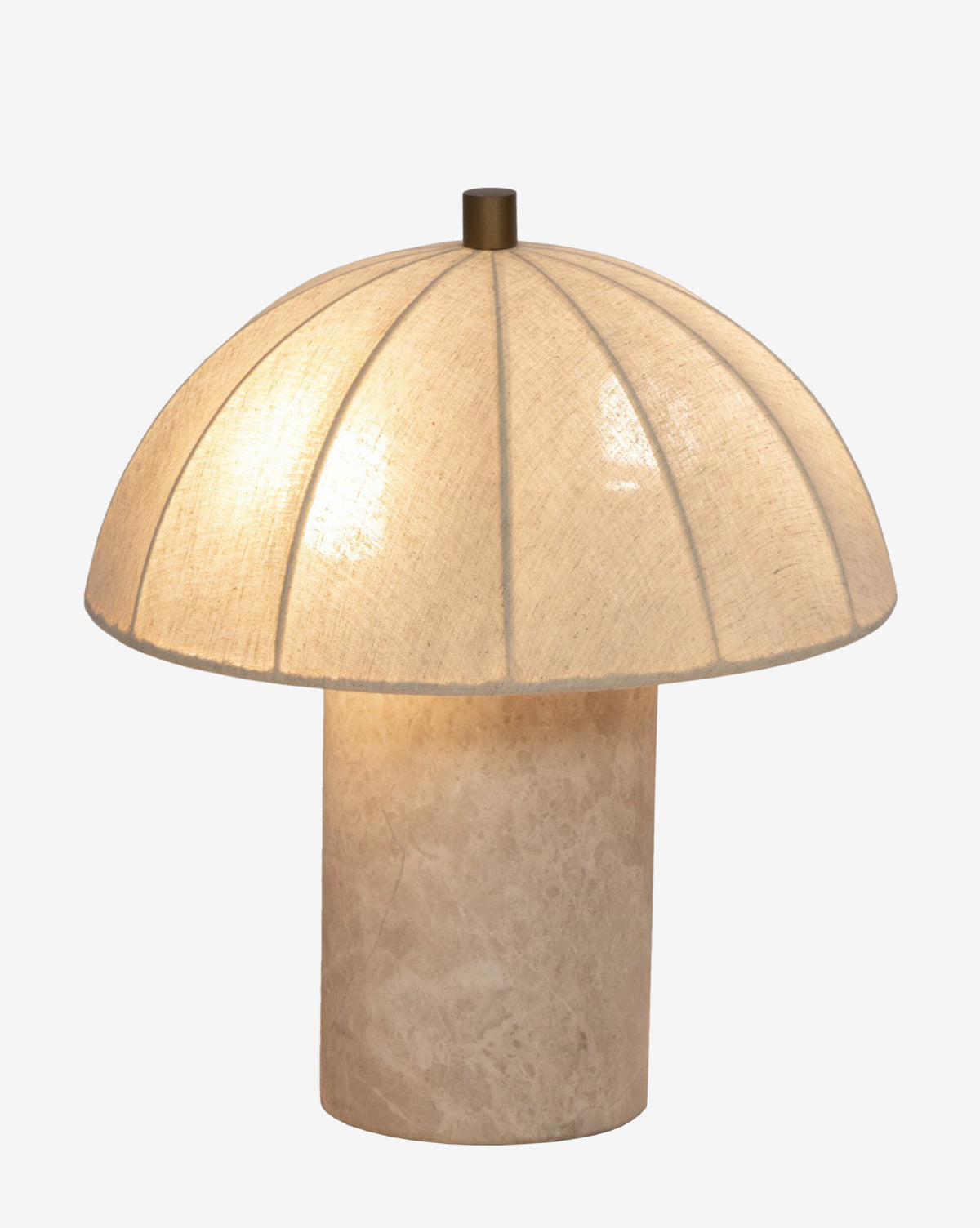 The Malinska Table Lamp features a wide linen dome shade and a cylindrical beige base, softly glowing against a plain white background, by Vendixs