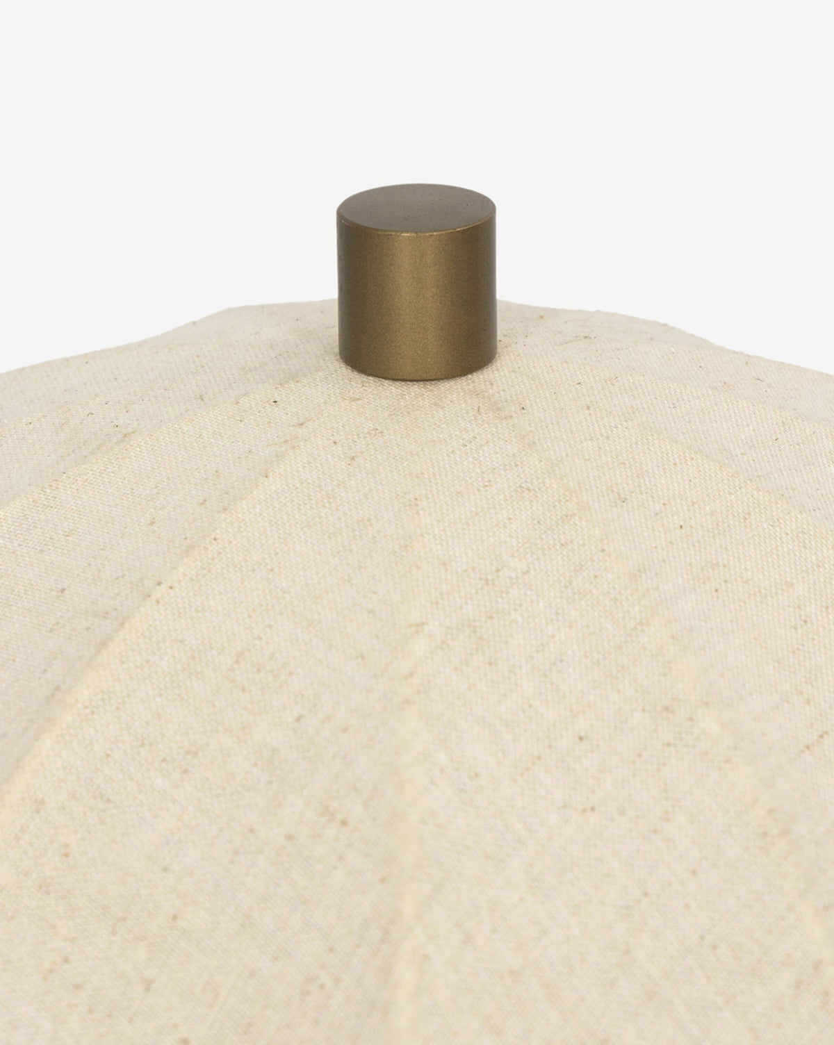 Close-up of the Malinska Table Lamp, showcasing its taupe marble base and textured beige fabric lampshade, topped with a round metallic knob against a white background, by Vendixs