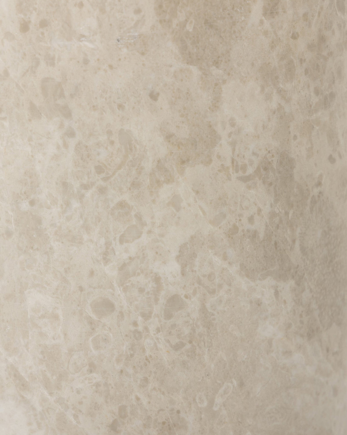Close-up of a light beige marble surface, like that on the Malinska Table Lamp, with a natural, smooth texture featuring subtle color and pattern variations, including small speckles and veins, by Vendixs