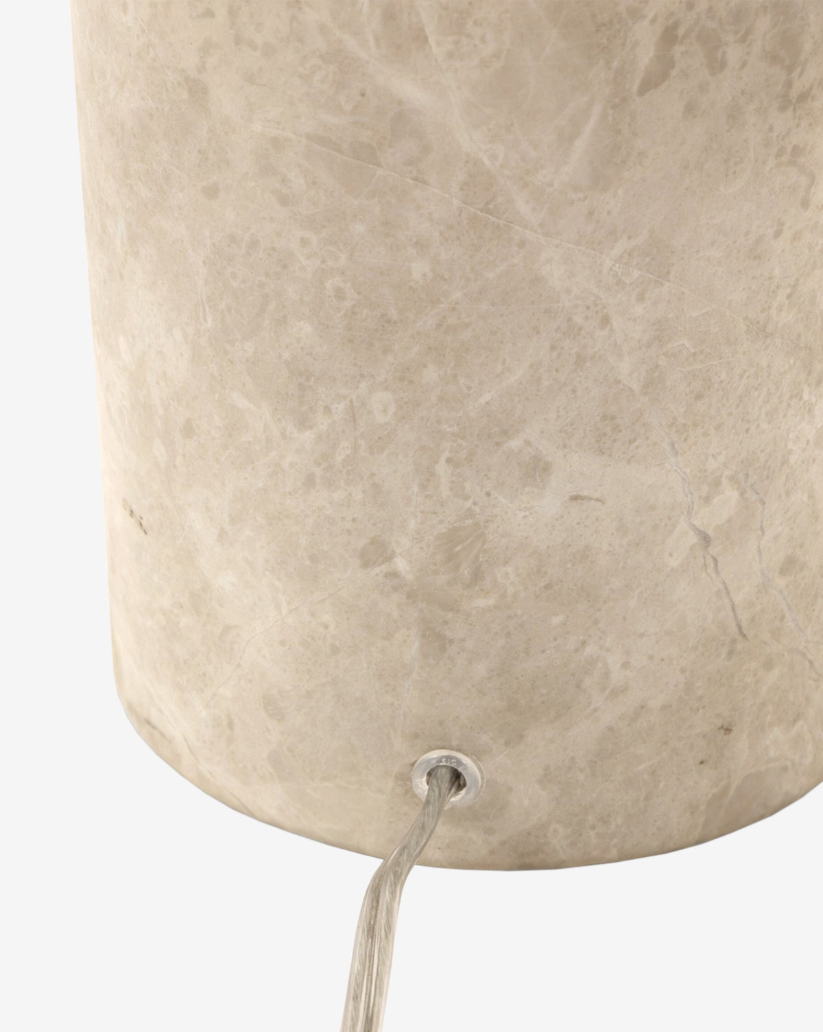 Close-up of the base of the Malinska Table Lamp, featuring a taupe marble finish with a light gray, marbled texture and a clear electrical cord emerging from a hole near the bottom, by Vendixs
