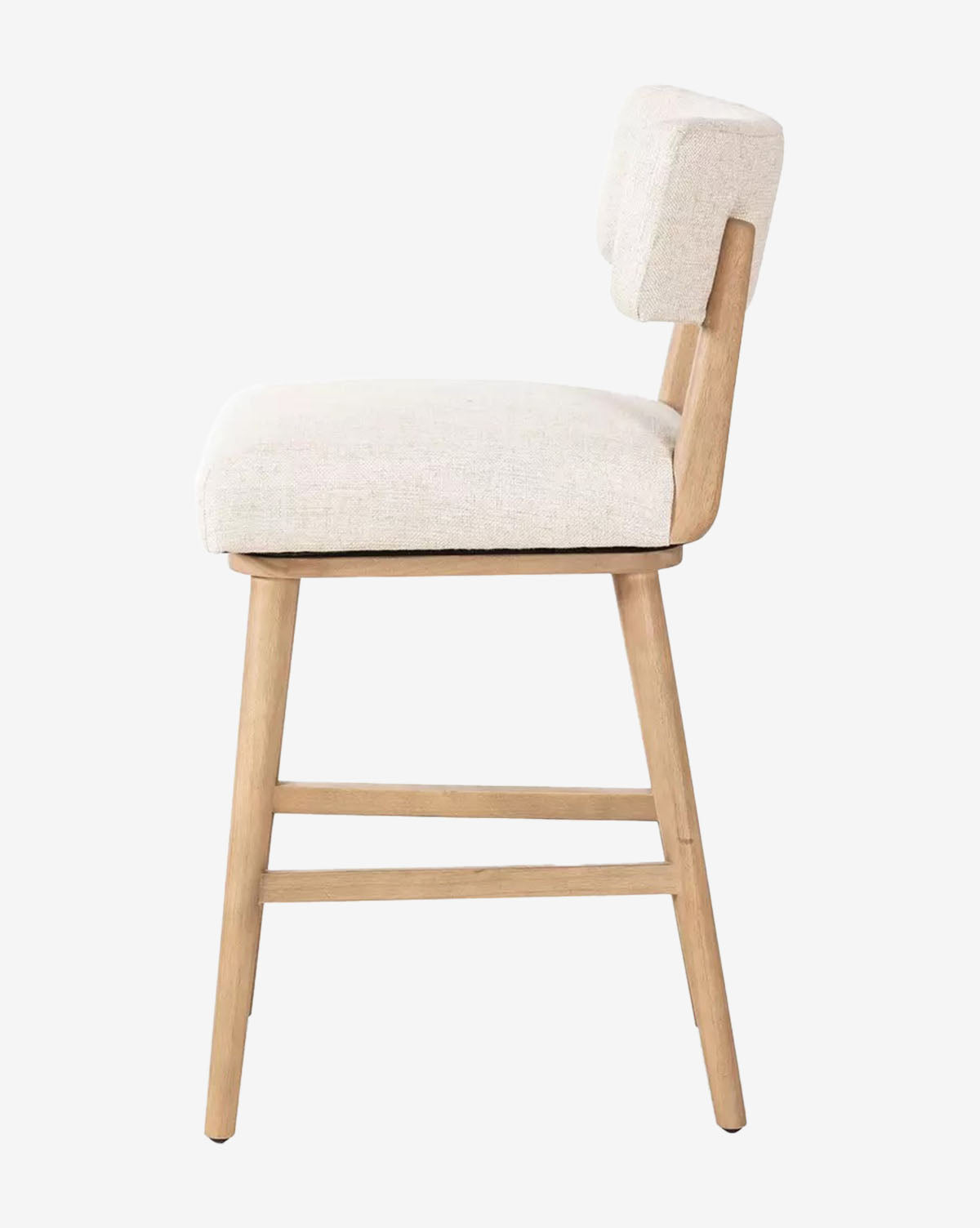The Four Hands Mance Swivel Stool features light wood legs and a beige upholstered seat and backrest, shown in a side view against a plain white background, Vendixs