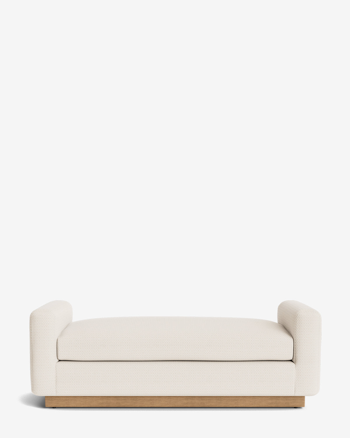 The Mansfield Bench features cream upholstery, short rounded armrests, and a wooden base. Handcrafted for contemporary sophistication, this modern, low-profile bench enhances any space by Vendixs