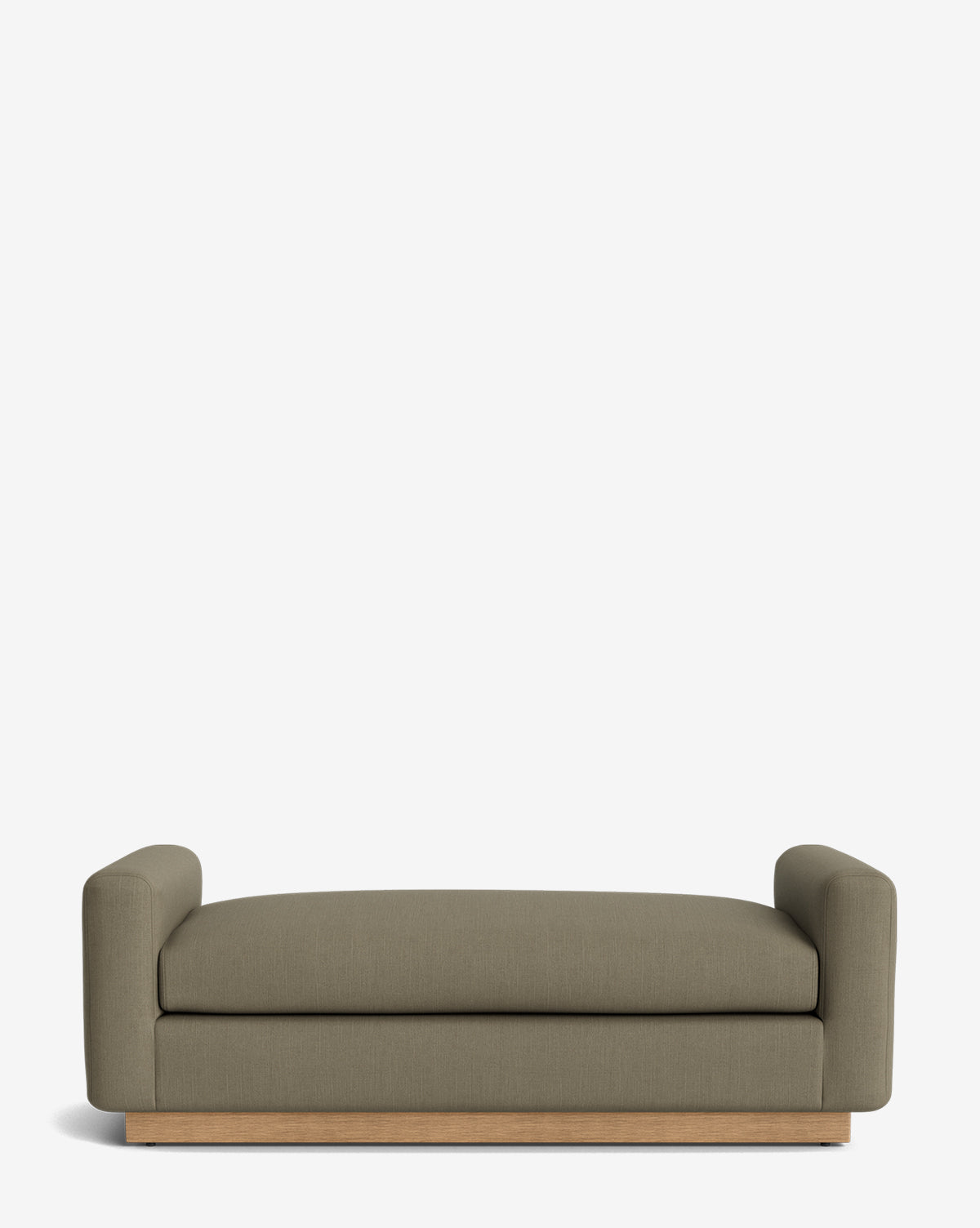 A modern olive-green sofa with low, rounded arms and a wooden base on a plain white background pairs beautifully with the Mansfield Bench, adding extra style and seating, by Vendixs