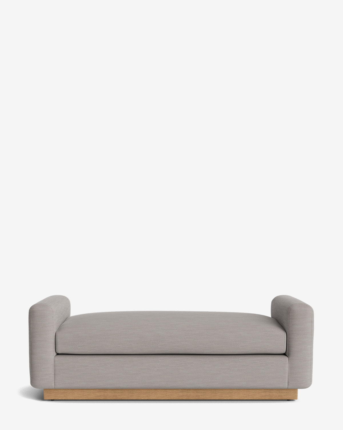 The Mansfield Bench is a modern bench featuring light gray upholstery, low rounded arms on each side, and a wooden base, by Vendixs