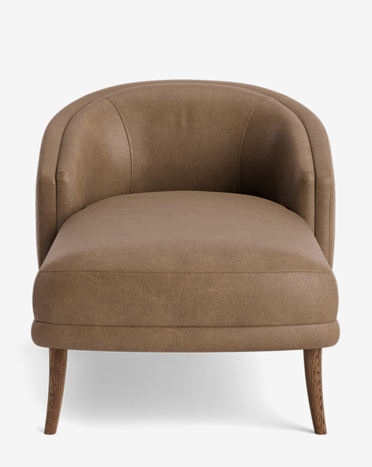 The Marguerite Chaise Lounge is a modern brown leather armchair with a rounded backrest and seat, featuring four wooden legs, inspired by the classic design and set against a plain white background by McGee & Co.