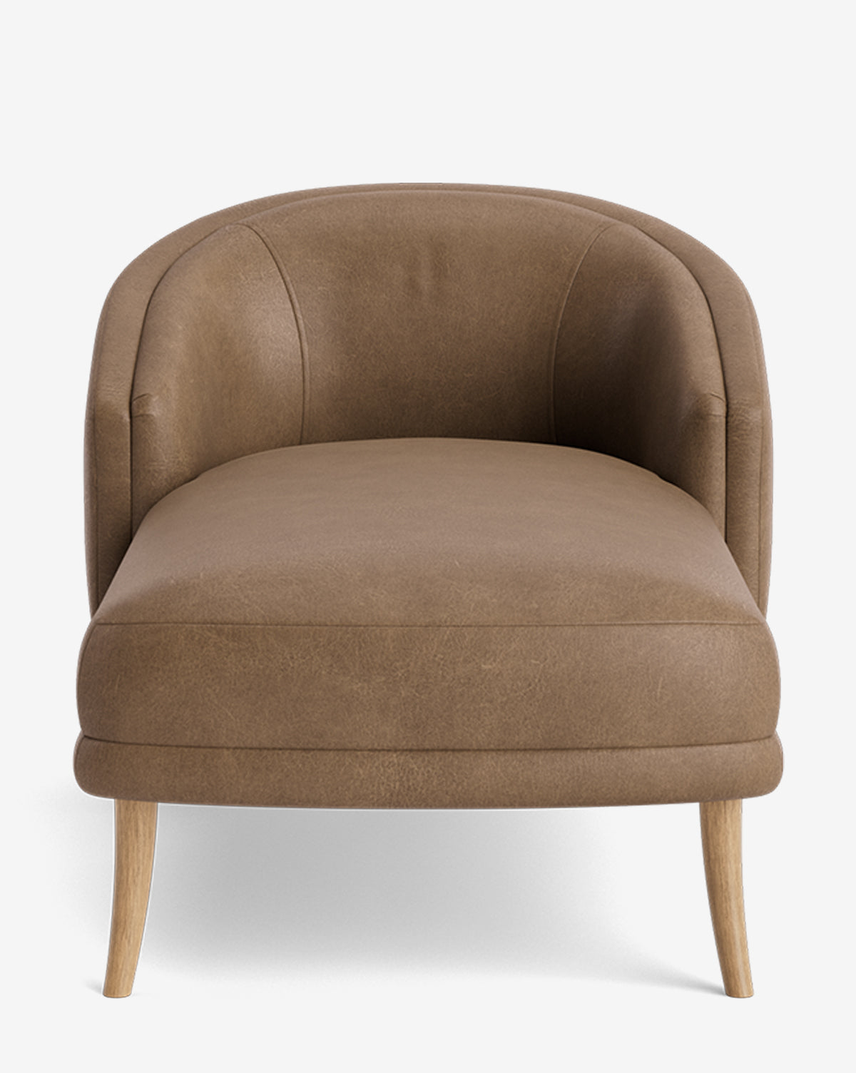 The Marguerite Chaise Lounge is a brown leather accent chair with a curved backrest, plush seat, and light wooden legs, shown from the front against a white background by McGee & Co.