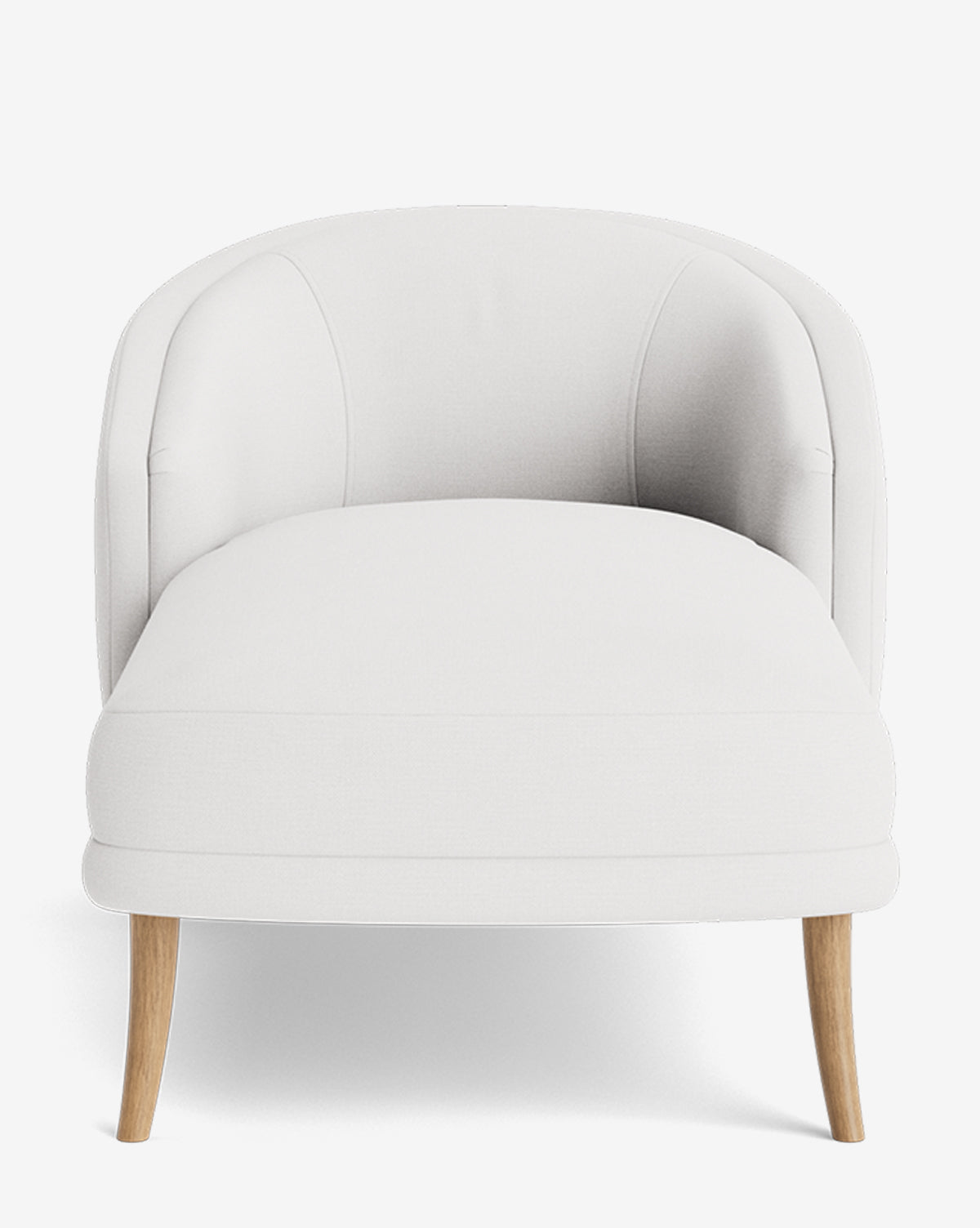 The Marguerite Chaise Lounge is a modern white upholstered armchair with a rounded backrest and light wooden legs, shown from the front on a plain white background by McGee & Co.