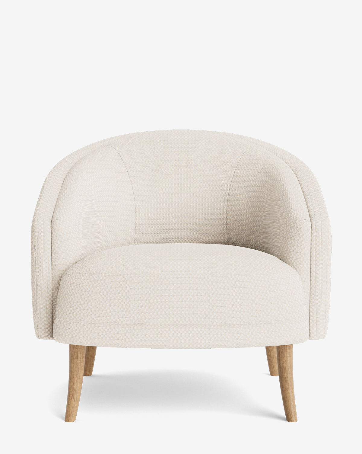 The Marguerite Lounge Chair showcases a low, off-white silhouette with textured upholstery, a curved backrest, and four light wood legs, set against a plain white background by McGee & Co.