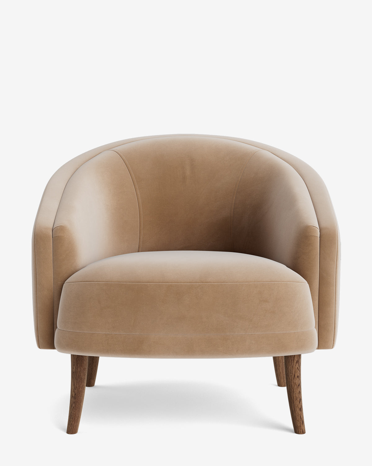 The Marguerite Lounge Chair features tan velvet upholstery, a curved backrest, rounded armrests, and four angled wooden legs. Its cushioned seat provides comfort and style, shown against a plain white background by McGee & Co.