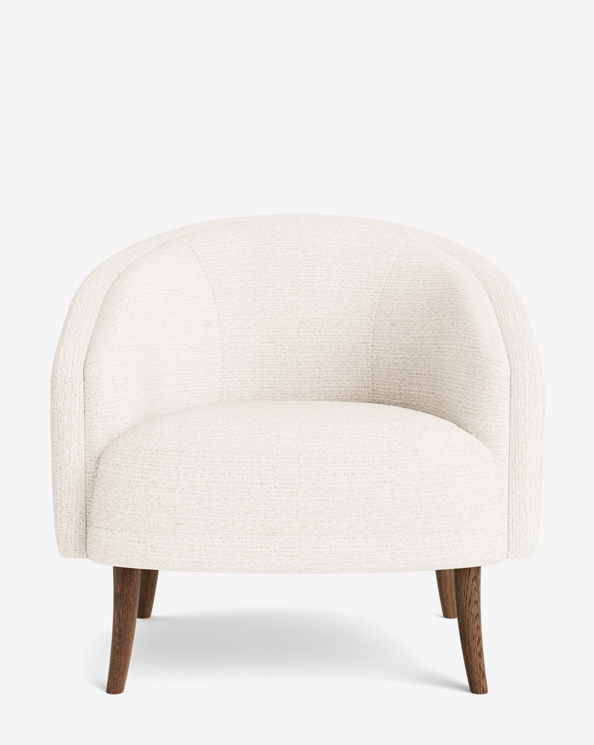 The Marguerite Lounge Chair is a modern armchair featuring a rounded backrest, cream textured upholstery, and four angled wooden legs, displayed against a plain white background by McGee & Co.