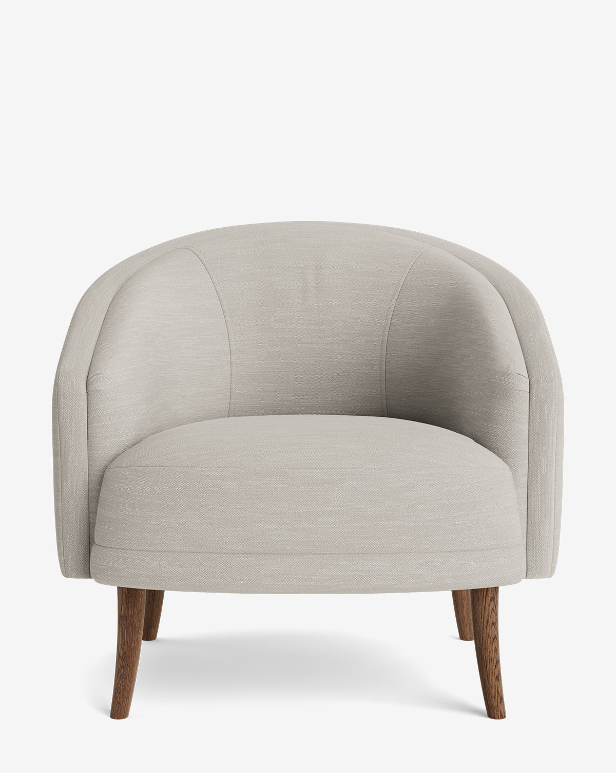 The Marguerite Lounge Chair is a modern armchair with light beige upholstery, a rounded backrest, curved armrests, and four angled wooden legs, shown against a plain white background by McGee & Co.