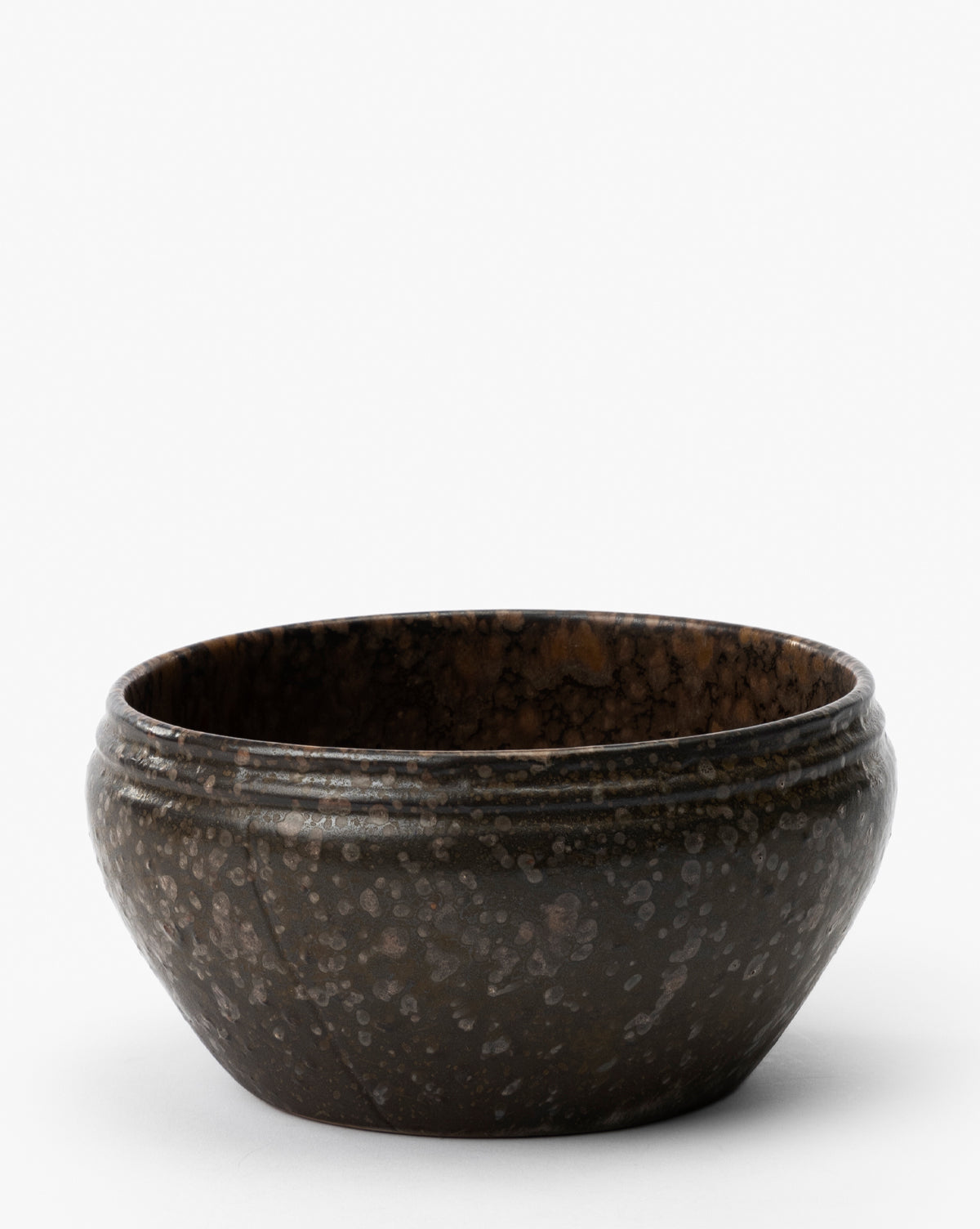 The Mariella Stoneware Bowls (Set of 4) feature a dark brown, speckled finish and slightly flared rims, highlighting their handmade quality against a plain white background, by Vendixs
