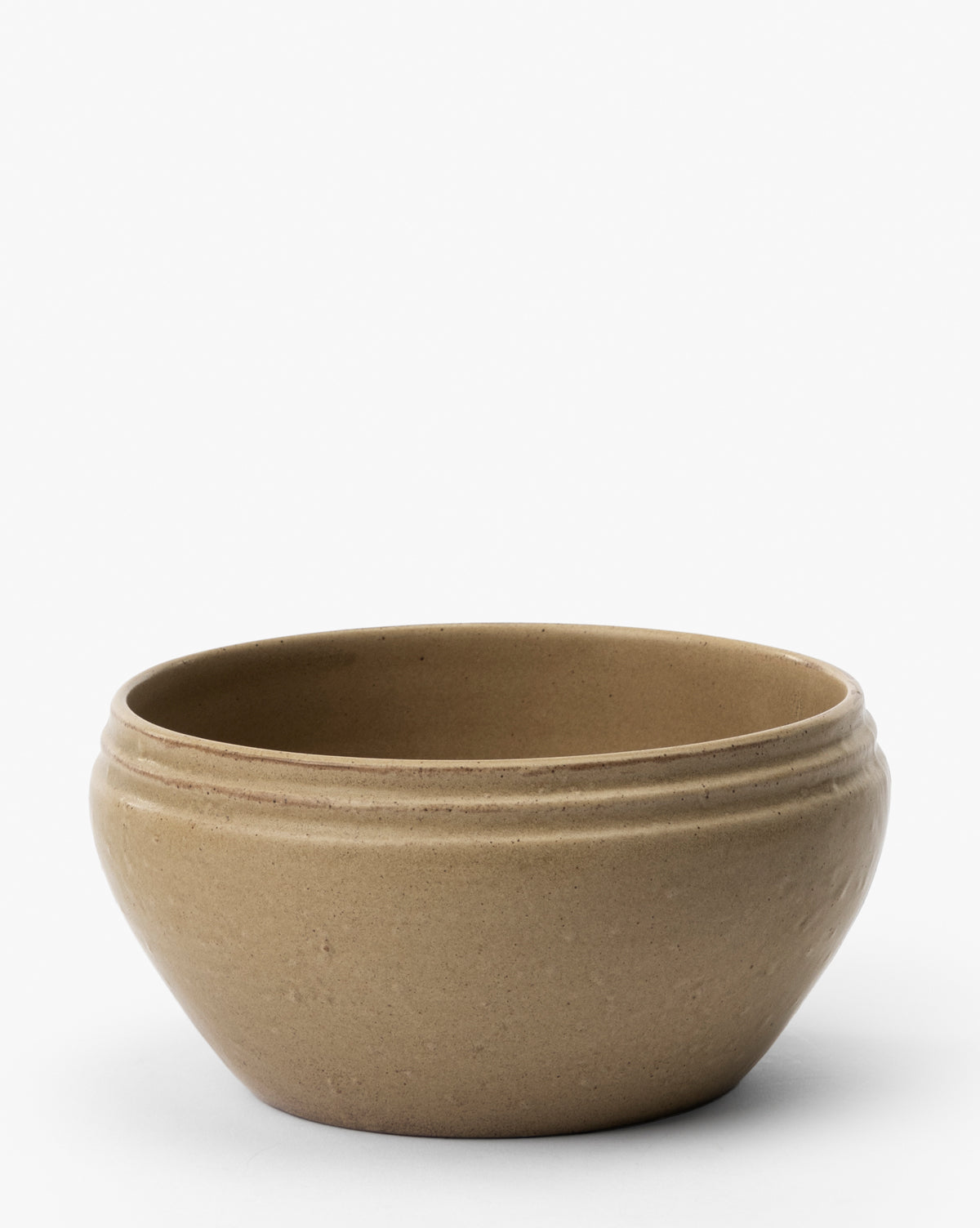 The Mariella Stoneware Bowls (Set of 4) feature a simple, round tan design with a slightly flared rim and subtle horizontal grooves near the top, highlighting handmade quality against a plain white background, by Vendixs