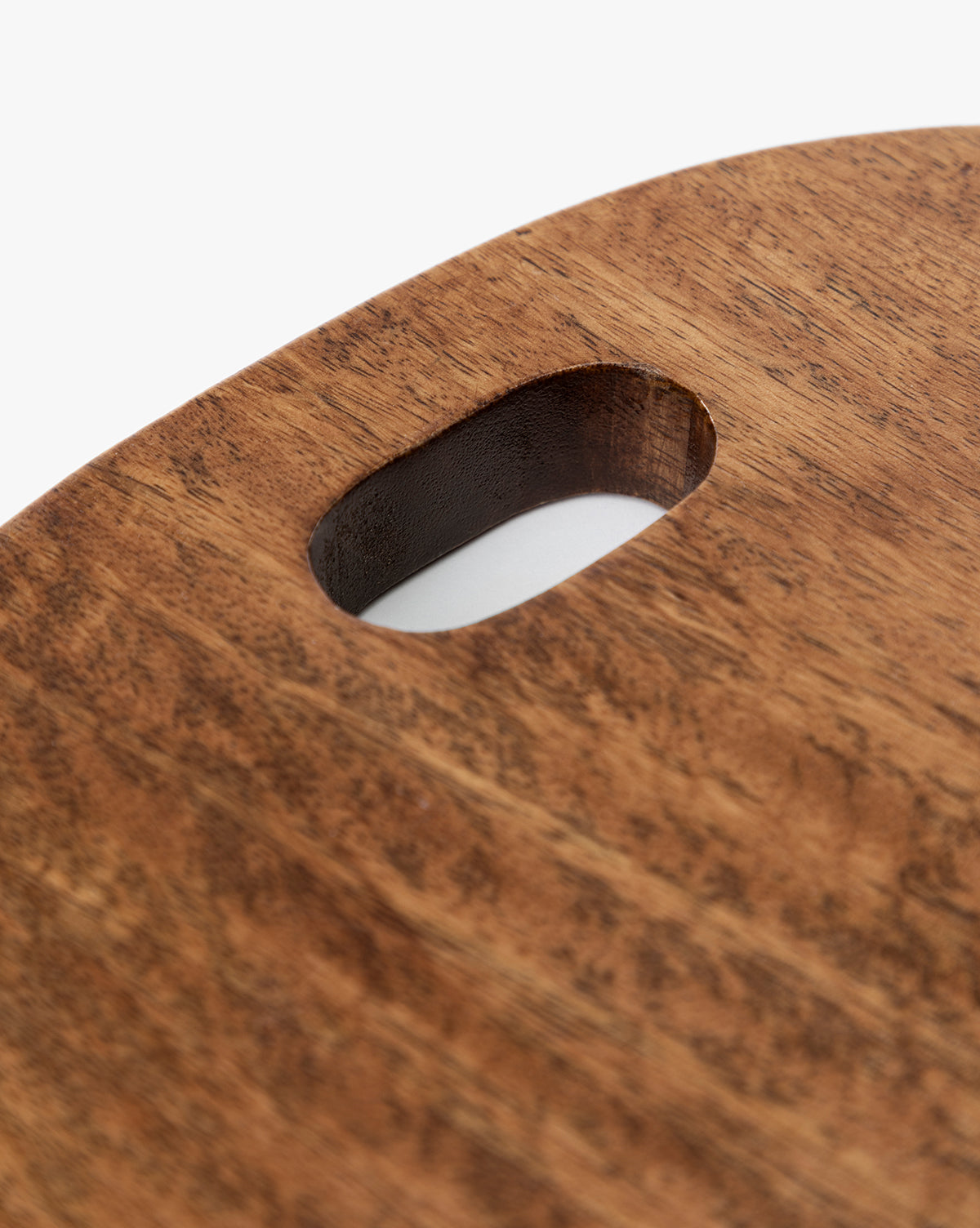 The Marlton Breadboard features a rounded edge and oval handle cutout, crafted from smooth wood with a natural brown finish—adding artisanal charm to any kitchen décor, by Vendixs