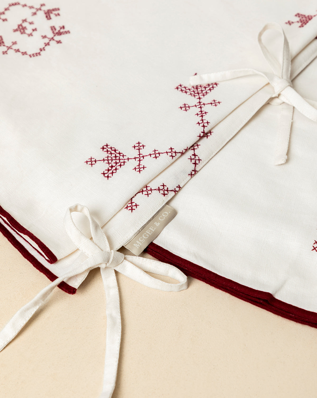 A woven MIGUEL & CO. label adds heirloom charm, making this piece ideal for holiday decor or as a vintage tree skirt, by Vendixs