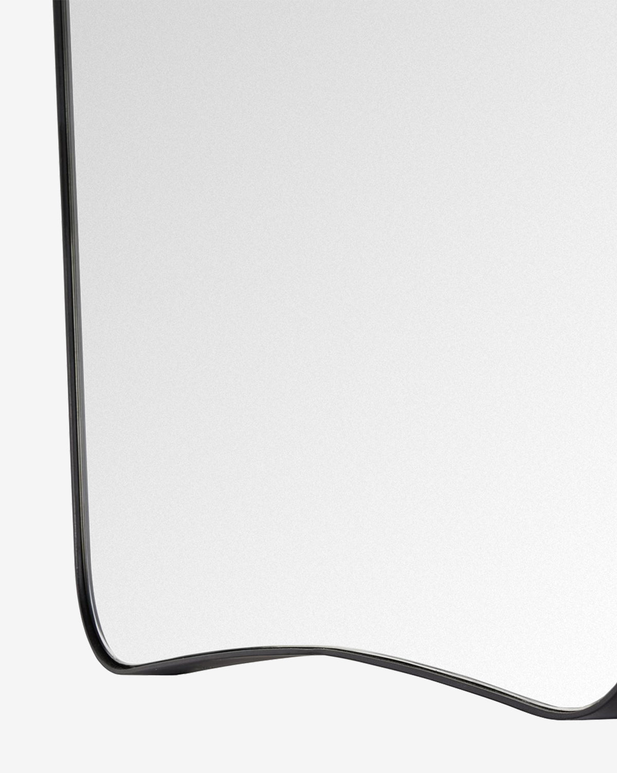 A close-up of the Meera Iron Mirror’s modern iron frame, featuring just the bottom left corner against a plain light background, by Vendixs
