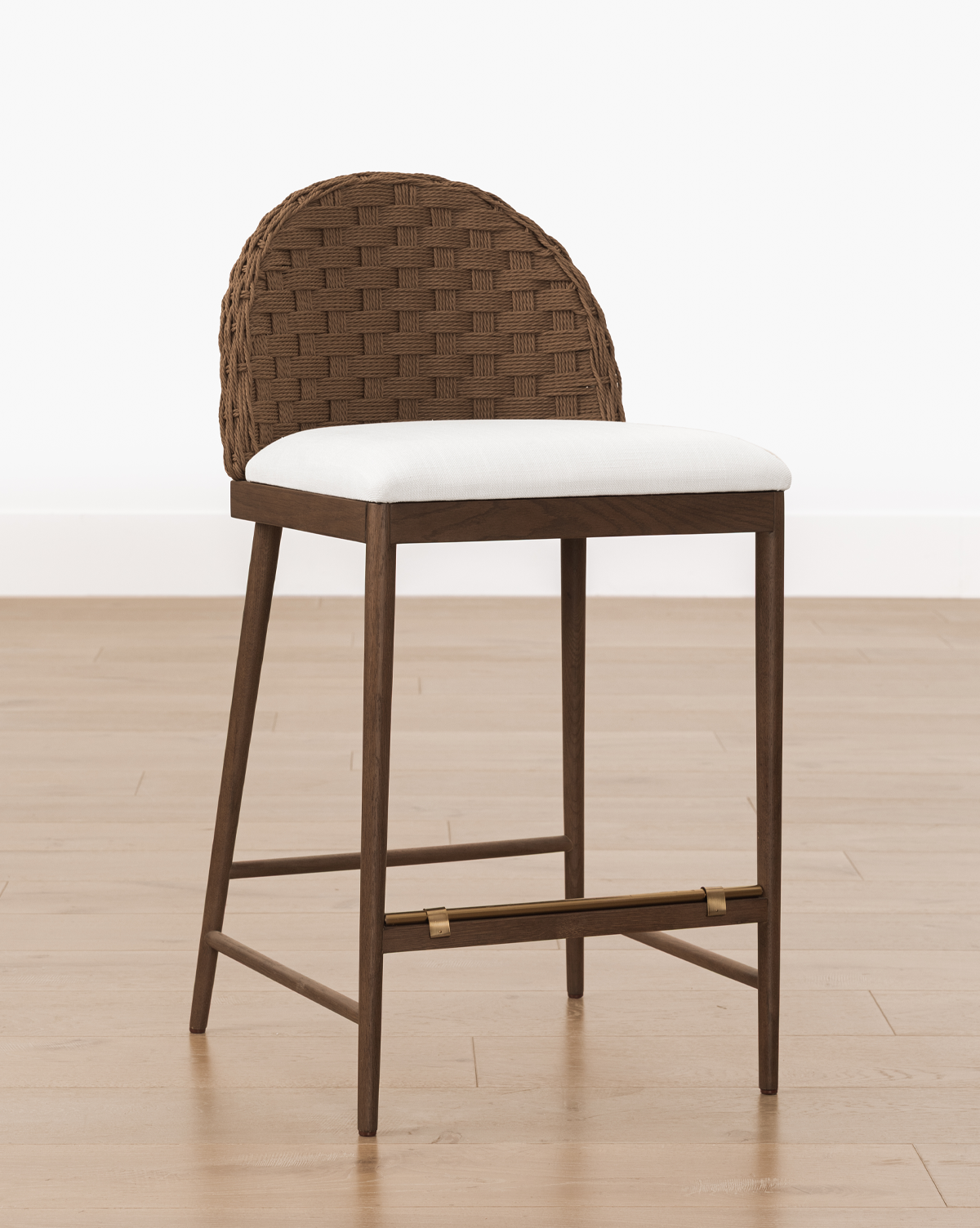 Set on a light wood floor against a plain white background, it perfectly blends style and comfort as the ideal counter stool, by Vendixs